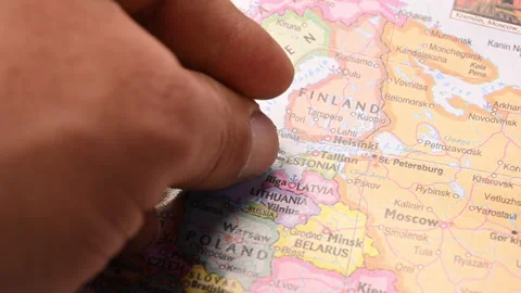 Man Push Pin Pointing On  Estonia On World Travel Map Stock-Footage 328085330