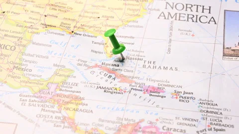 Man Push Pin Pointing On  Nassau On World Travel Map Stock Footage 328074857