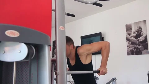 The man pushed on the bar at the gym Stock Footage 71588533