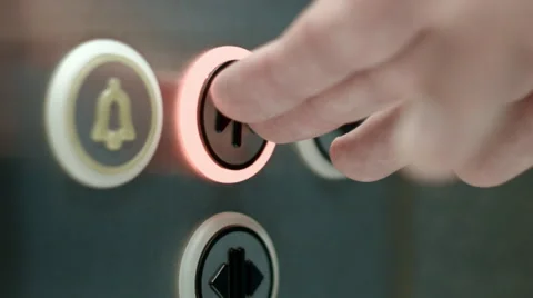 Man pushes a button closing elevator doors. Close up Stock Footage