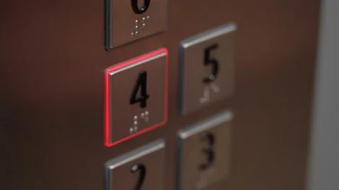 Man pushes button of fourth floor in elevator Video stock 147194257
