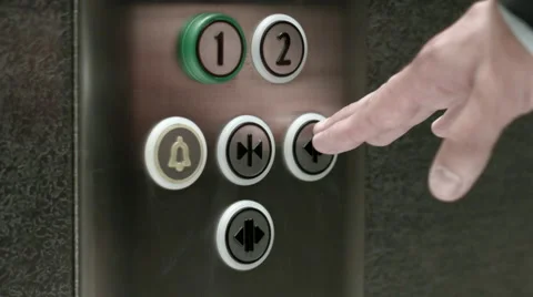 Man pushes a button opening elevator doors Video stock 51457025