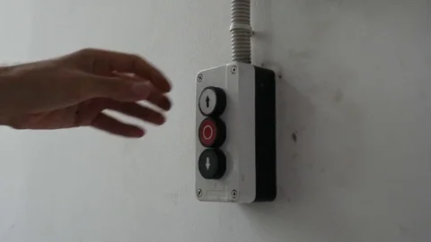 Man pushes a button opening the gate Stock Footage 71194002