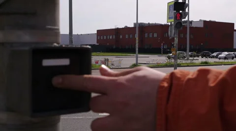Man pushes a button switching traffic Stock Footage 50962932