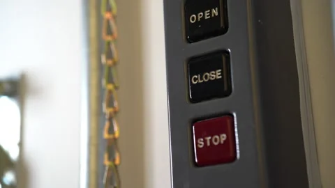 Man pushes close button on industrial garage door opener. Stock Footage 140212416