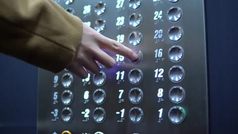 A man pushes a floor button in an elevator - closeup Video stock 133121343
