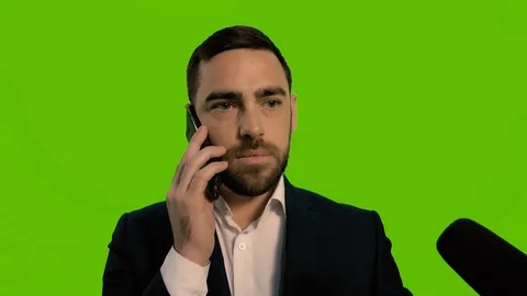 Man pushes a microphone with his hand, no comments concept. Isolated green Video stock 125267551