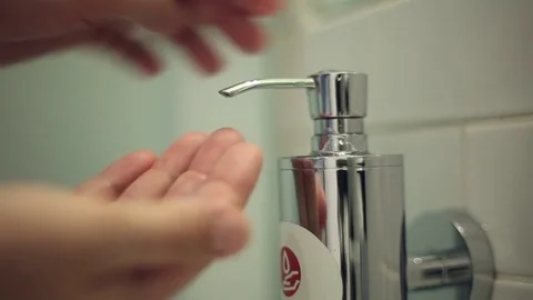 Man pushes a portion of liquid soap Stock Footage 76480519
