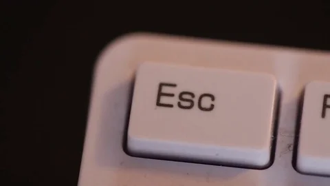 Man pushes a white button escape. Macro shooting Stock Footage 72560624
