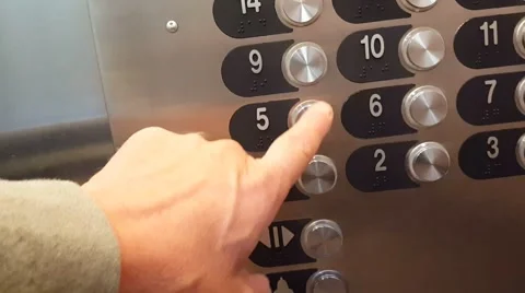 A man pushing an elevator button Stock Footage 68764418