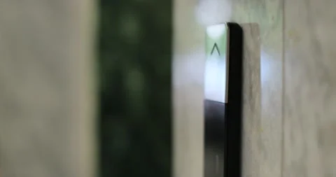 Man pushing elevator button in modern building or hotel. Male finger pressing Stock Footage 314496478