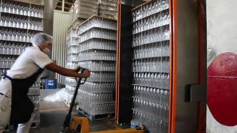 Man pushing empty bottles inside a container Stock-Footage 155118226