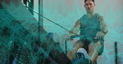 Man pushing legs initiating rowing stroke for fitness, with turquoise digital Video stock 330169762
