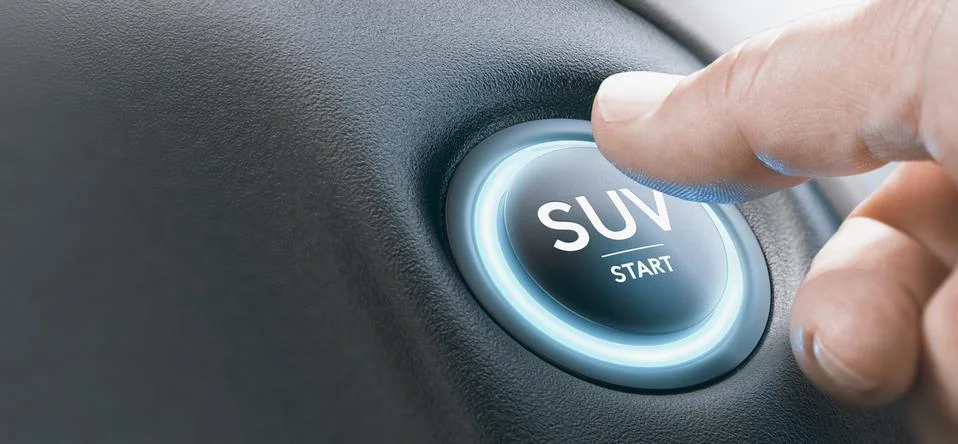 Man Pushing a SUV Start Button. Stock Photos