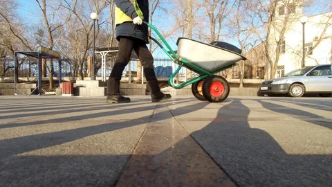 Man Pushing A Wheelbarrow.. Bottom view. 動画素材 87577727