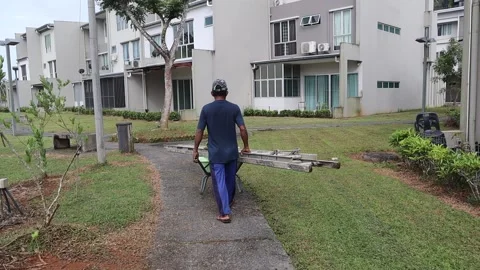 Man Pushing Wheelbarrow Stock Footage 170168472