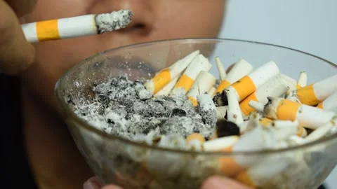 A man put ash of cigarette on ashtray Stock Footage 252018858