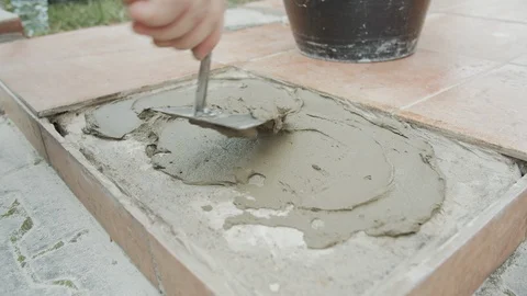 A Man Put The Cement On The Floor Stock Footage 116740139