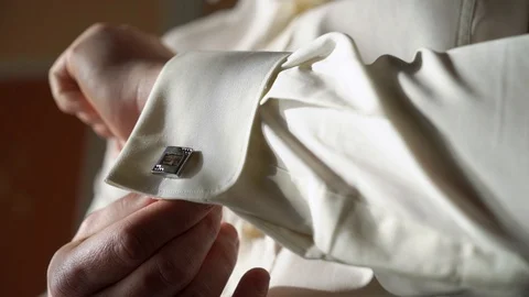 Man put on cuff links Stock Footage 103624695