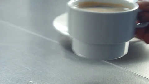 Man put cup of coffee on the table Stock Footage 87251278