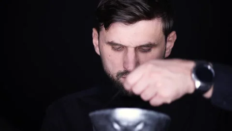 The man put on a gray skeleton mask and adjusted it on his face Video stock 163242492