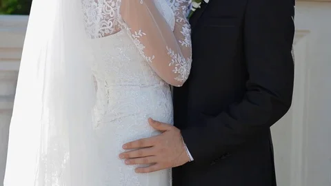 Man put hand on the bride's hip Stock Footage 70862641
