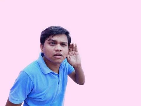Man put hand over ear to listen carefully Stock Photos