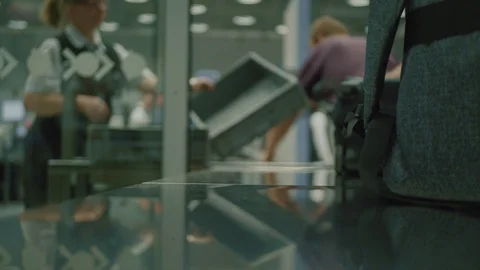 A Man Put his Baggage in the Box for the Airport Security Check Stock Footage 112205787