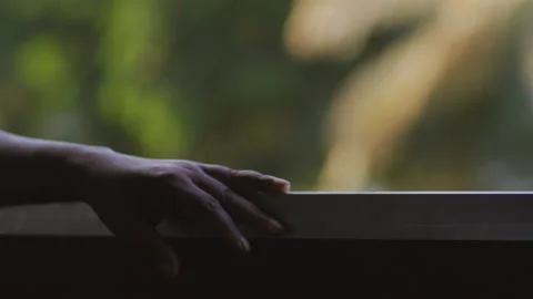 Man put his hand by the window on a moving old train, Tanzania Africa Stock Footage 132462665