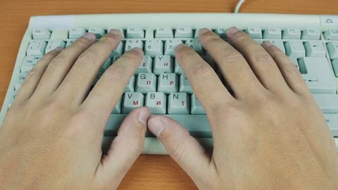 The man put his hands on a computer keyboard Stock Footage 70170771