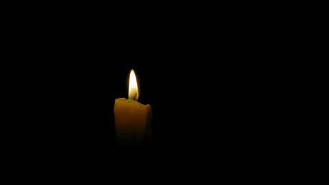Man put out the candle with his fingers, close-up Stock Footage 128341347