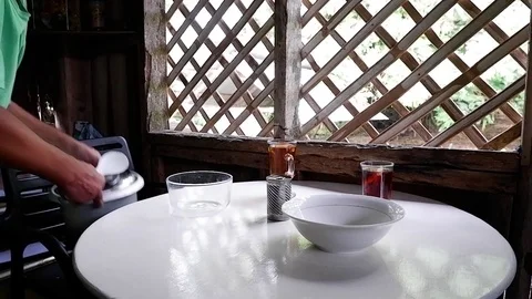 Man put a pan on a white table Video stock 122157535