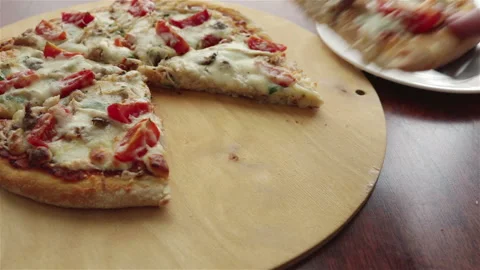 Man put pizza slice on plate with spatula Stock Footage 249372266