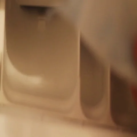 The man put the powder in the washing machine Video stock 69444947