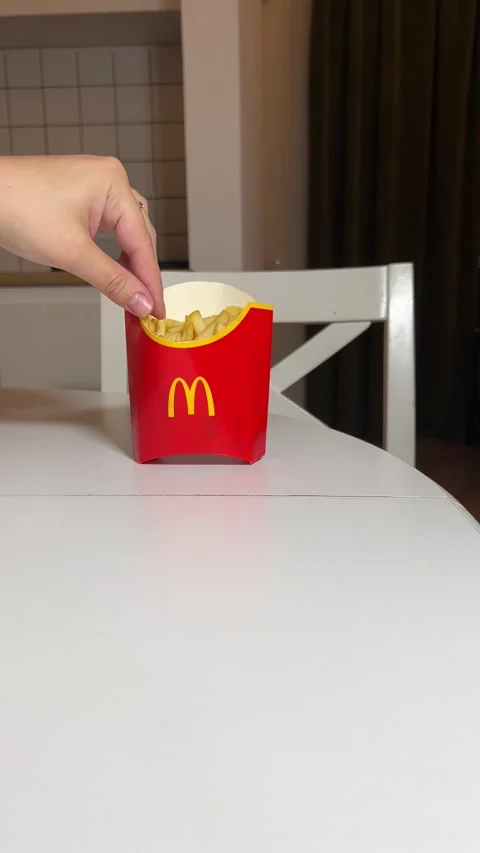Man put in red paper bag with yellow McDonald's logo Stock Footage 304767985