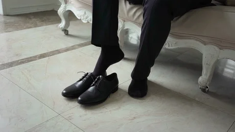 Man put on shoes Stock Footage 110820521