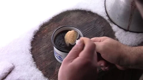 Man put sugar in a cup of coffee and mix with a spoon Stock-Footage 60401442