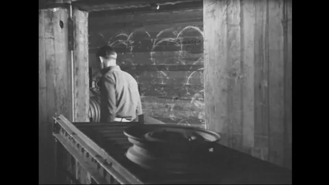 Man put tyre rims on the conveyor belt of automobile factory - 1939 Stock Footage 101983499
