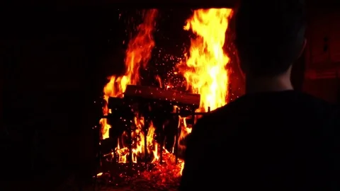 Man put wood into the fire Stock-Footage 80916430