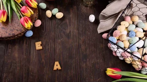 Man put word Easter on table Stock Footage 125136520