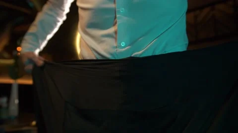 Man is  puting on a uniform. Stock Footage 168515860