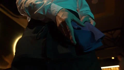 Man is  puting on a uniform. Stock Footage 168515887