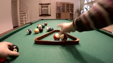 Man puts all balls in triangle, 4K Stock Footage 46896877