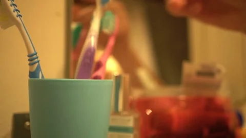 Man puts back brush from a plastic cup Stock-Footage 70071521