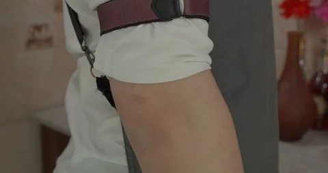 Man puts on a bar apron Stock Footage 130050745