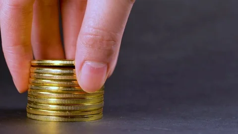 Man puts bitcoins btc bit coin in pile.. Wealth. Stock Footage 106350770