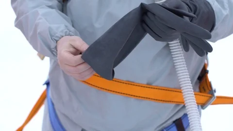 Man puts on black rubber gloves Stock Footage 122245265