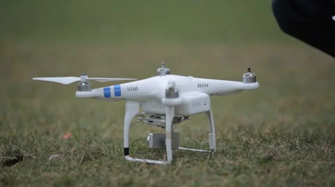 Man puts blades on quadrocopter close up Stock Footage 58195411