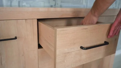 Man puts book in wardrobe Stock Footage 140908882