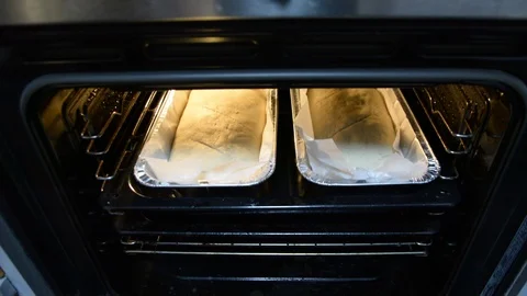 Man puts the bread in the oven. Bread making process Видео 103866038